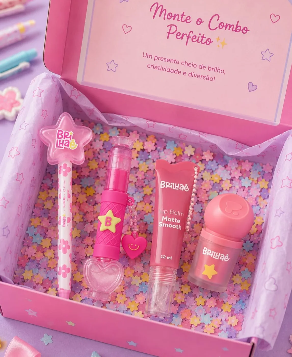 Kit de presente rosa com itens de papelaria e cuidados pessoais
